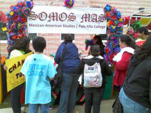 Somos MAS Student Organization at Palo Alto College Students play the Chancla Toss at the Somos MAS booth during PACfest.