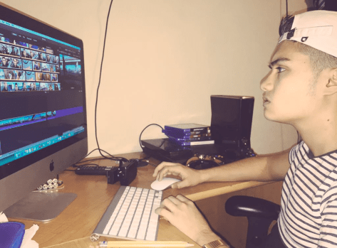 Photo ofTim Sanchez-Vega, editing his youtube videos.