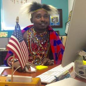 Photo of Nelson Lemeria Ole Ngotiek on the computer.