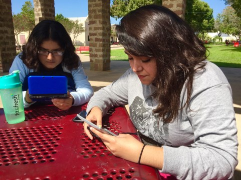 (Pictured from left to right) Evelin Ortega and Sarah Lopez play their Nintento DS games between classes.