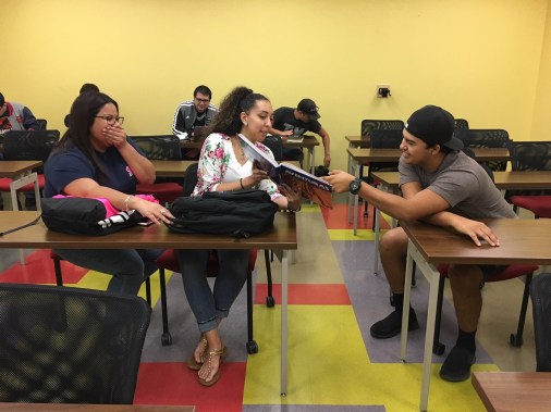 (Left to right) Students Lilliann Morales, Briana Reed and Joseph Flores laugh their way into learning in Profesora Vélez-Cobb’s Spanish class, SPAN 1411.